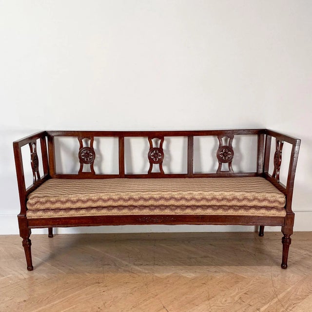 2 Northern Italian settees in walnut, one 18th Century the other one made to match in the 19th Century 34.5" high (rail)...