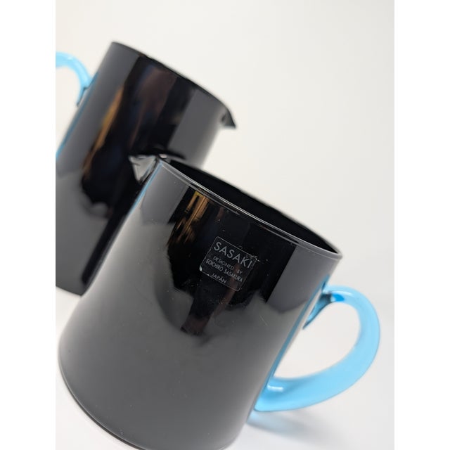 This is a chic pair of vintage 'San Marino' art glass pitchers by Soichiro Sasakura for Sasaki. Produced in the 90s, these...