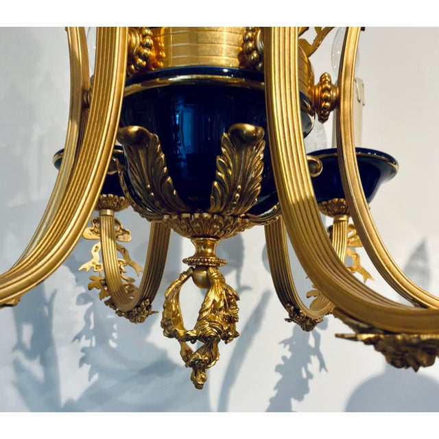 Original retail $4512, stylish Myran Allan Luxury Lighting Italian 24K Gold Finish and Blue Porcelain Chandelier, showroom...
