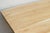 This dining table brings the sun-bleached textures of the California coastline into a solid, architectural form. Hand-...