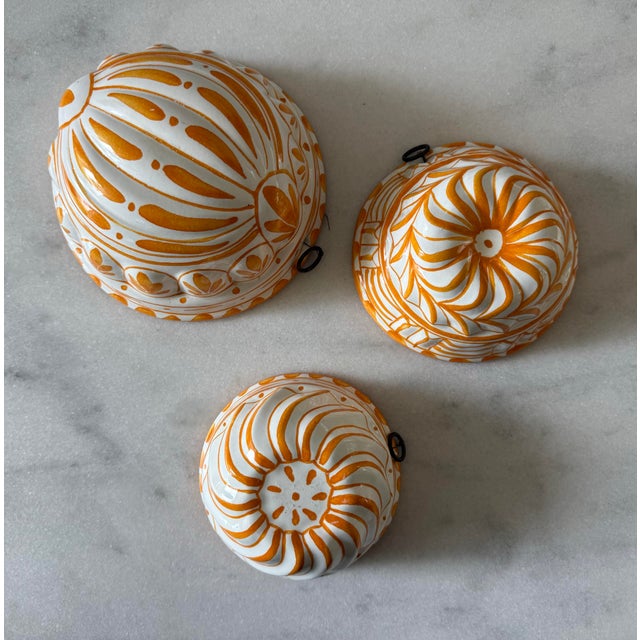Set of 3 vintage hand painted ceramic jelly molds made by ABC in Bassano Italy. 3 piece set in graduated sizes and orange...