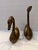 Vintage pair of brass swans. Great accent pieces to add a little whimsy to a bookcase or sideboard. Would be fun in the...