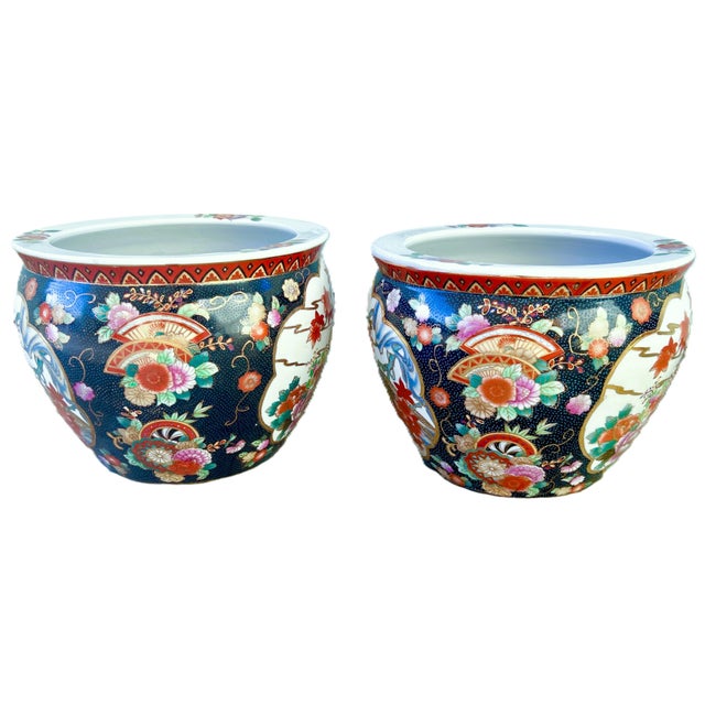 Mid Century pair of handmade Chinese fishbowl planters. Adorned with intricate patterns including moriage like raised...