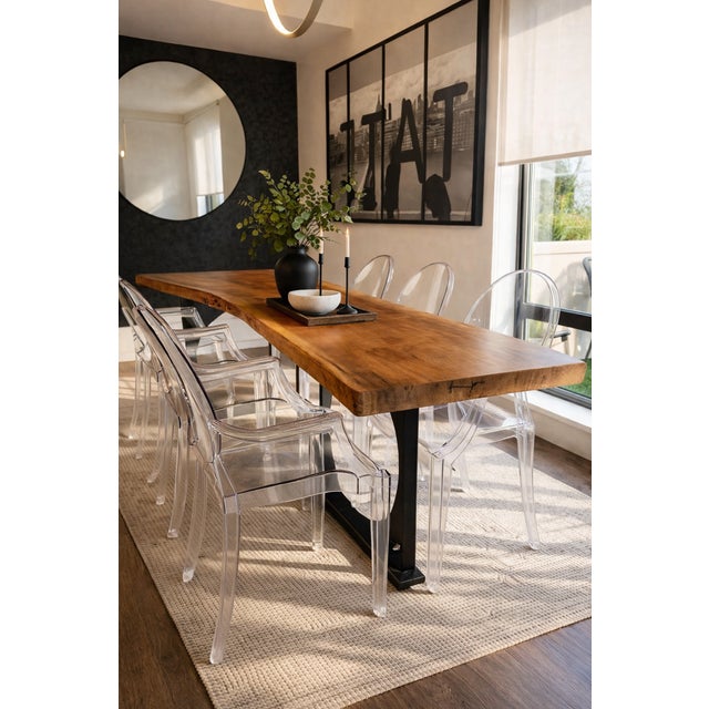 7’ long with an organic depth from 34” to 24”. Handcrafted live edge wood top with custom matte black metal legs, designed...