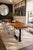 7’ long with an organic depth from 34” to 24”. Handcrafted live edge wood top with custom matte black metal legs, designed...