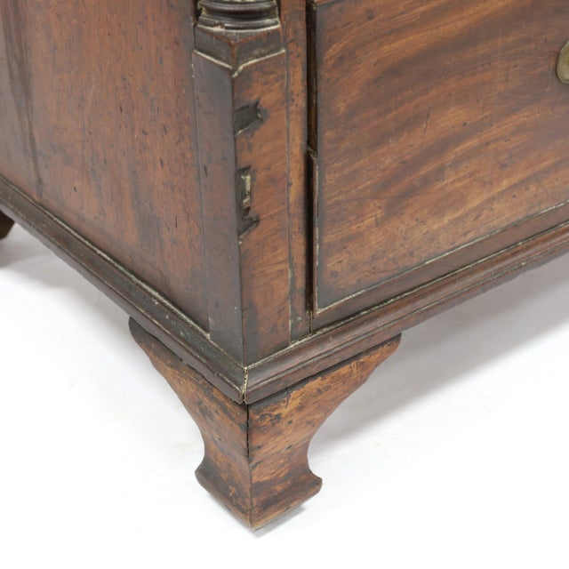 Circa 1800, mahogany veneers, oak and pine secondary, rectangular veneered top with cross banded edge inlay and light wood...