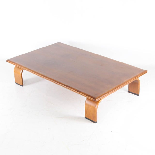 Large Japanese coffee table from the 1970s, made of oak. It features a semicircular base and a solid oak top. The lower...