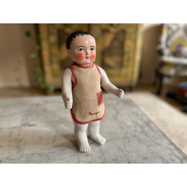 This exquisite Biedermeier porcelain bathing doll, dating back to around 1820, is a fascinating piece of early toy...