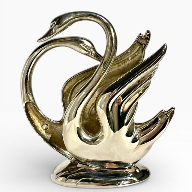 Vintage silver plate swan form napkin or mail holder. Fits one magazine perfectly. A pair of swans back to back. Sourced...