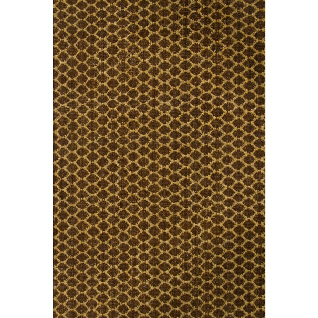 Hand-knotted in wool, this 5x8 contemporary geometric rug showcases an allover honeycomb lattice in rich golden-brown and...