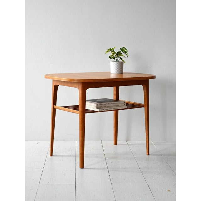Vintage oak coffee table with slatted shelf and lightweight structure. Original product with Kägers Industrier AB label....