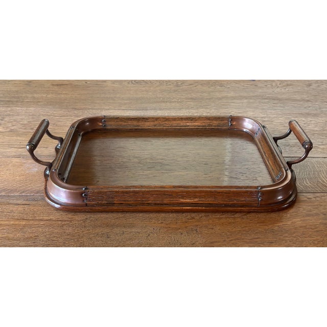 A tray made to be both admired and used. This antique English oak tray combines solid craftsmanship with thoughtful,...