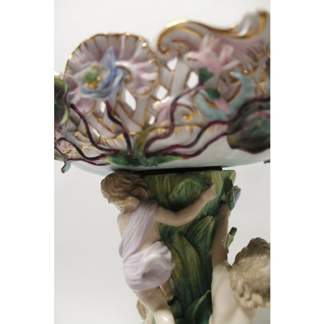 19th Century German Porcelain Figural Centerpiece / Compote Elegant German porcelain centerpiece featuring a finely...