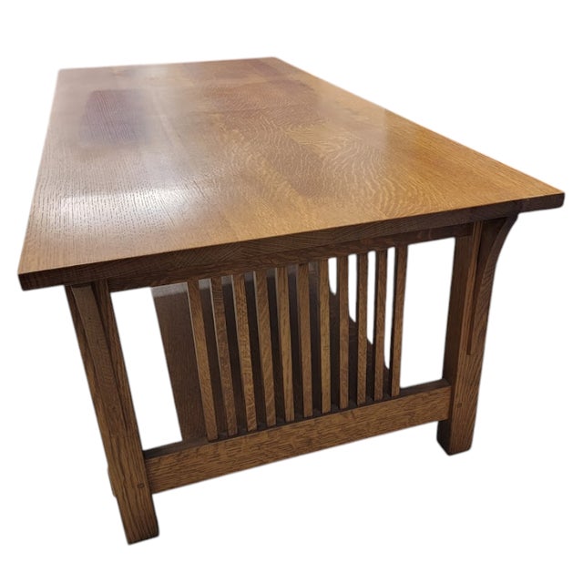 This a nearly pristine solid oak spindle coffee table made by Stickley. Circa 1989, part of the Mission Collection...