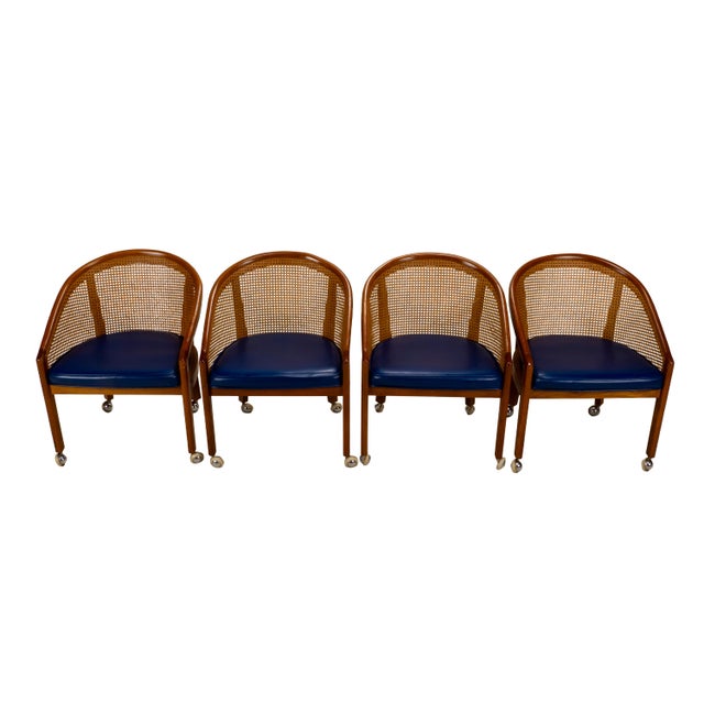 Stylish set of four bent oak and cane tub chairs in the manner of Ward Bennett, likely dating to the 1970s. The chairs...