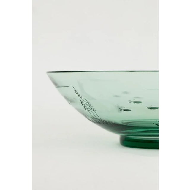 The vase with maritime motifs were designed by Göran Hongell and manufactured by the Karhula glass factory in Finland in...