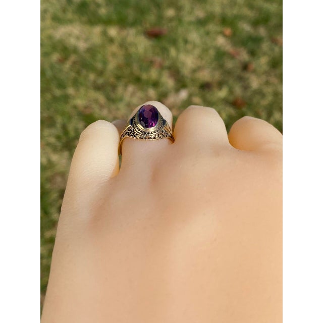 The Mount Elbert: Elongated Oval Sapphire in Antique Filigree Ring.The focal point of this ring is an elongated color-...