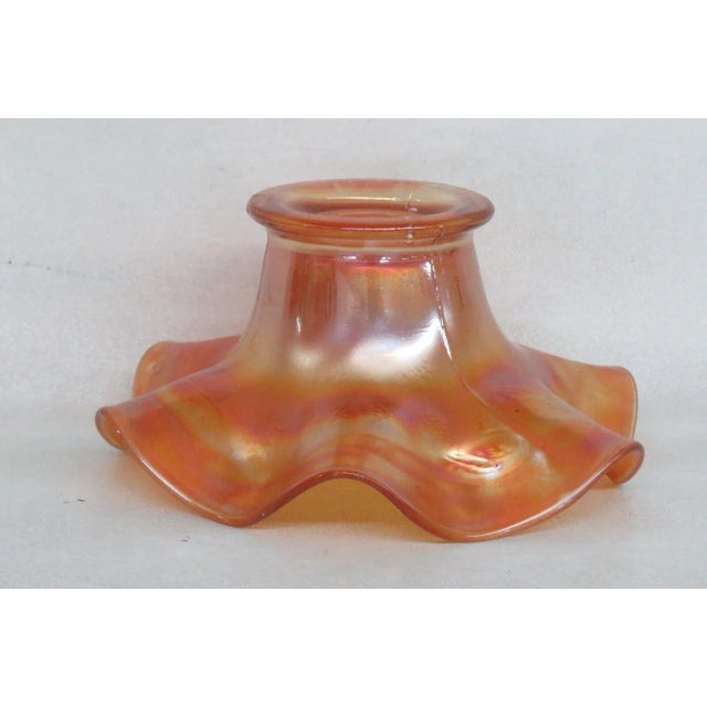 This magnificent bowl is made of carnival glass. This bowl is made in the "Blackberry Spray" pattern used by Fenton; it...