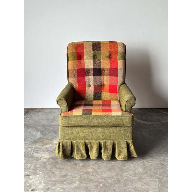 This is about as iconic 70s as a chair gets, from the high curved back down to the boxy pleated skirt. The body is...