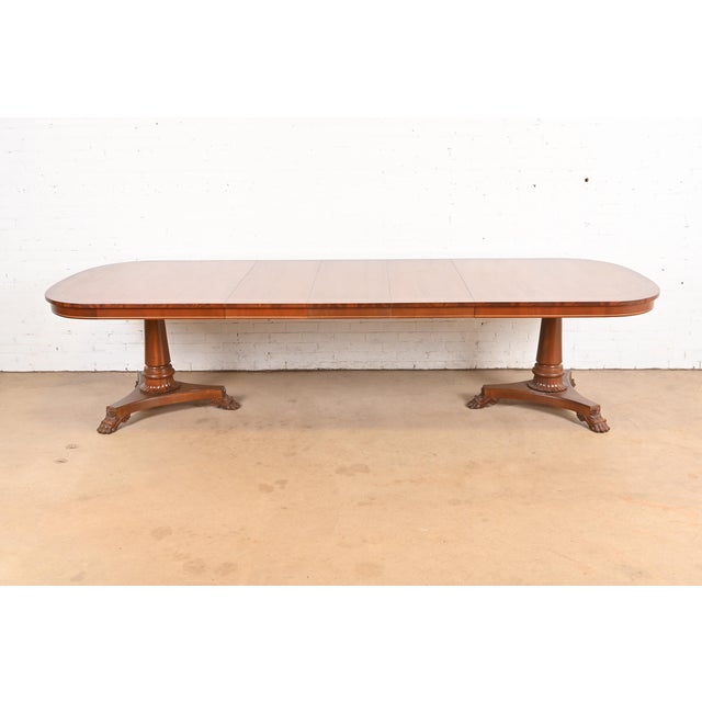 An exceptional Regency or Neoclassical style double pedestal extension dining table By Kindel Furniture USA, Late 20th...