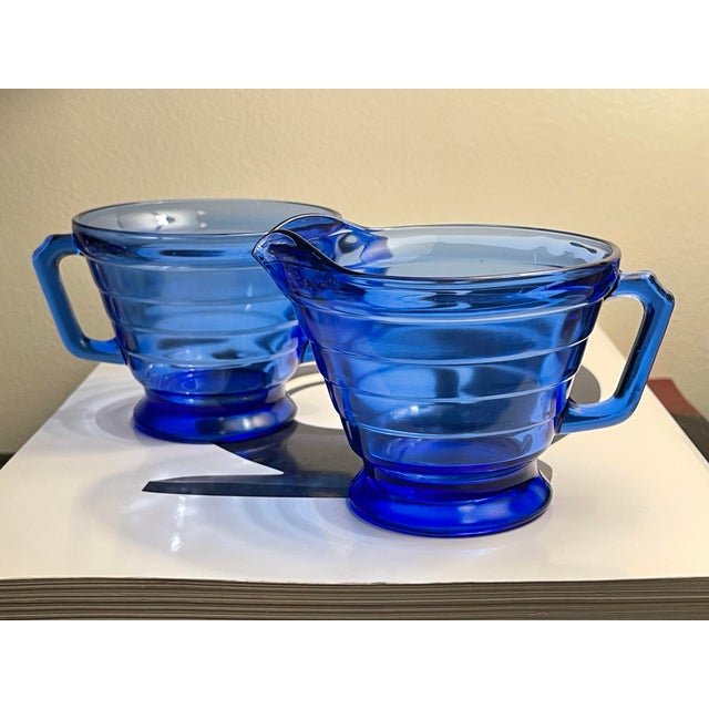Cobalt Blue Moderntone Cream and Sugar Set by Hazel Atlas, produced between 1934 and 1942. This set is a part of the...