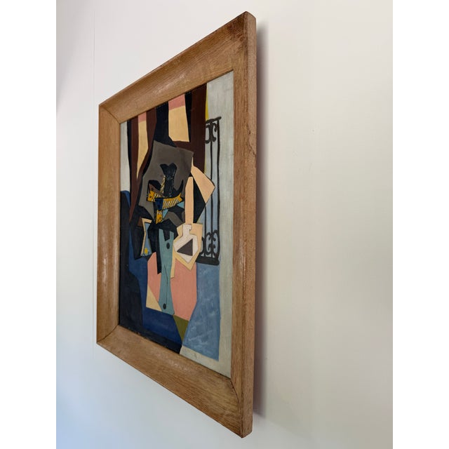 This is a colorful midcentury cubist still life with fish on canvas in its original frame. Not signed or dated.