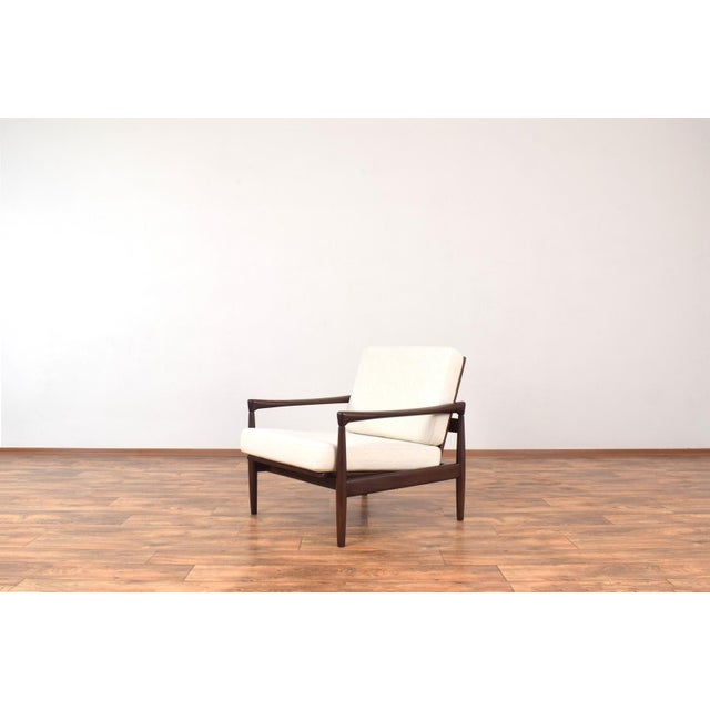 This lounge chairs was designed in the 1960s by Erik Wørts and manufactured by IKEA. The armchair frame is made of solid...