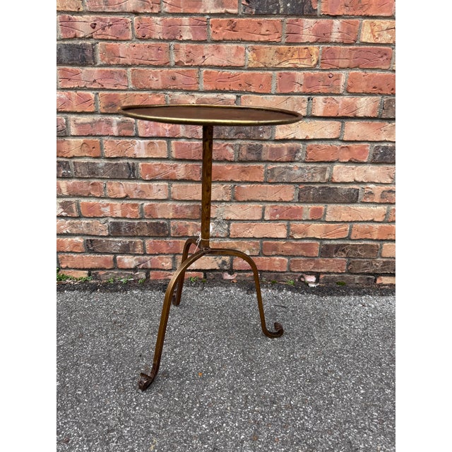 This is wonderful little Spanish made wrought iron drink table with an antiqued gold finish. It is contemporary yet...