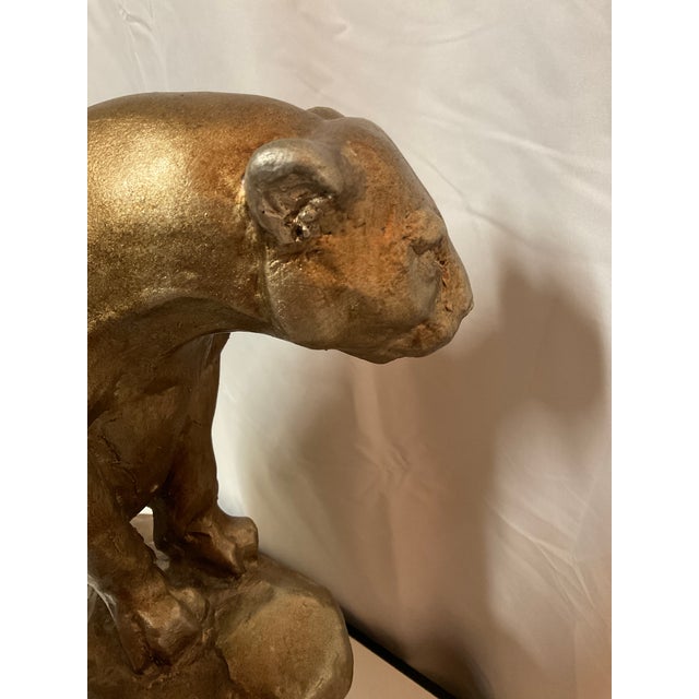 Mid century ceramic muscular sculpture of a regal cougar or mountain lion makes a stunning display on a shelf or pedestal.