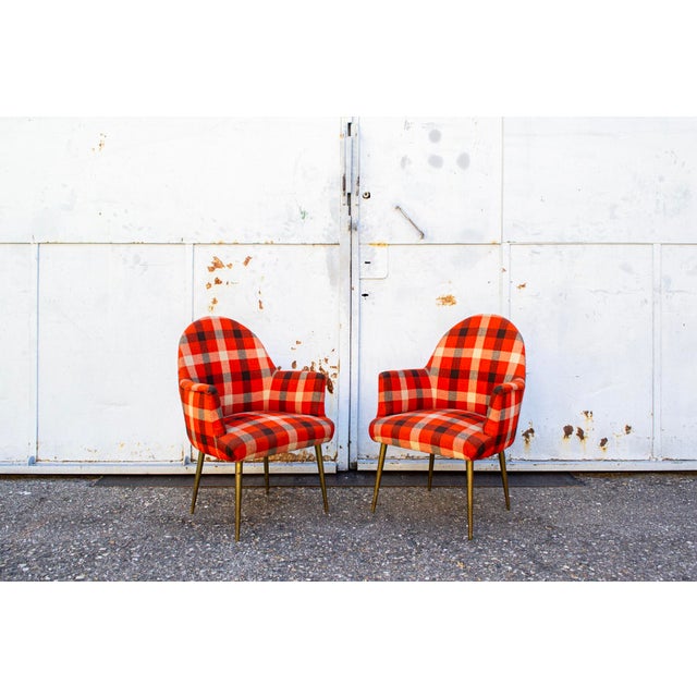 Pair of armchairs with original fabric upholstery and solid brass legs. Manufacturer: Arflex 1960s This piece is...
