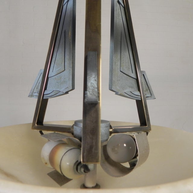 Elegant art deco-style pendant lamp from the 1980s, featuring a beautiful alabaster bowl that casts warm, diffused light....