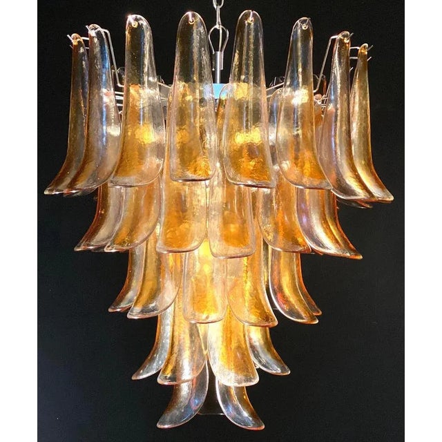 Pair of huge Italian vintage Murano chandelier made by 52 clear amber glass petals supported by a chrome frame. The clear...
