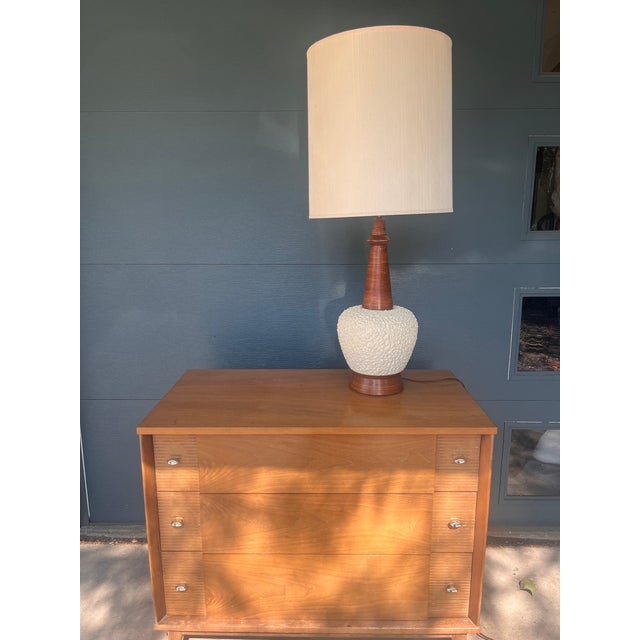 A striking Mid-Century Modern table lamp by Fortune Lamp Co., dated 1960 — marked on the base. The dramatic combination of...