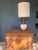 A striking Mid-Century Modern table lamp by Fortune Lamp Co., dated 1960 — marked on the base. The dramatic combination of...