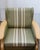 A matched pair of Danish oak lounge chairs by Henning Kjærnulf, produced in the 1960s and offered with the original...