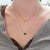 Elevate your elegance with this stunning 1.2 carat Zambian emerald pendant necklace. The vibrant oval emerald, measuring...