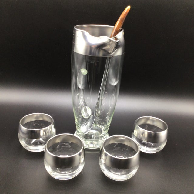 1960’s Dorthy Thorpe glass pitcher with thick silver band. 4 roly poly glasses. Glass stir stick measures 9 3/4 inches...