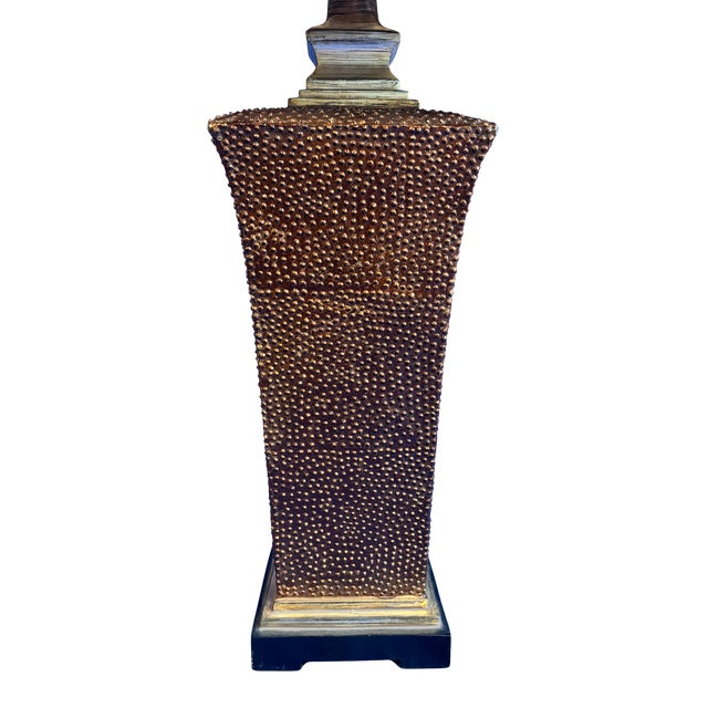 This Uttermost table lamp features a sculptural textured ceramic base inspired by classic Tuscan and Mediterranean design....