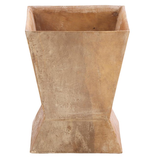 This elegant waste basket features a sophisticated hour-glass silhouette covered in a textured parchment finish. With a...