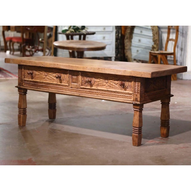 Bring warmth and old-world character to a living room or library with this substantial antique Spanish coffee table...