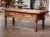 Bring warmth and old-world character to a living room or library with this substantial antique Spanish coffee table...