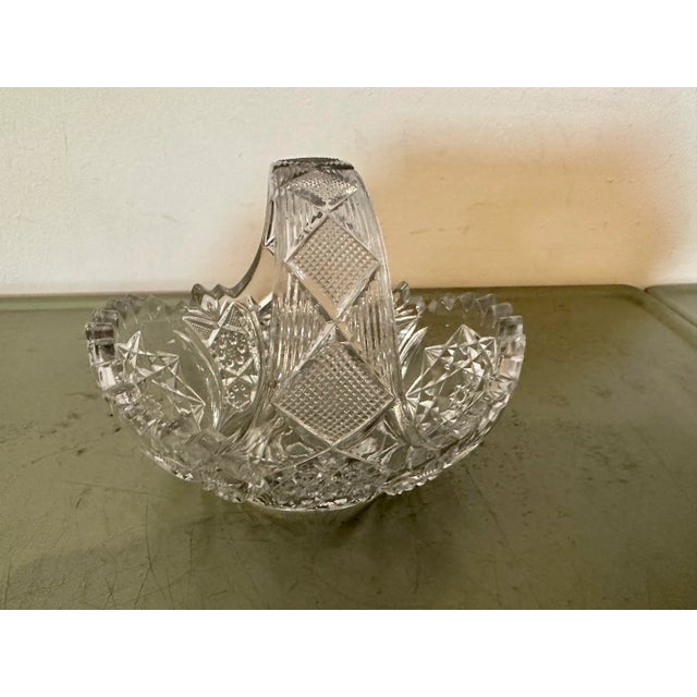 Sweet little cut/pressed glass basket.