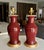 Pair of 19th century Chinese Asian Sang De Boeuf "Oxblood" glazed vases as table lamps mounted on turned giltwood bases....