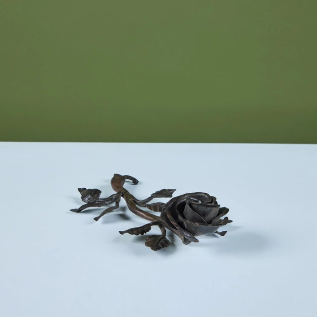 Cast iron rose sculpture. Dimensions 9" width x 4.75" depth x 2" height. Condition Good vintage condition.