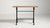 A classic French 20th century bistro side table with a durable cast iron base and a warm wooden top. The robust iron...