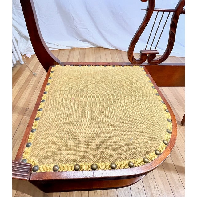 Charming vintage mahogany phone table designed in the classic Duncan Phyfe style.