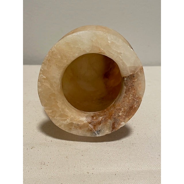 An Egyptian alabaster jar with age signatures suggesting a possible ancient origin, acquired at the estate of a well-...