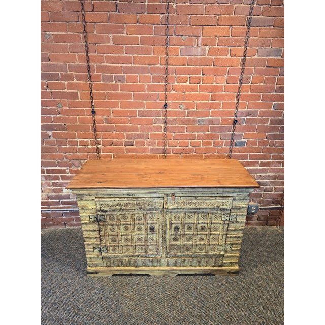 Bring a touch of Old World global charm to your home with this stunning, hand-crafted solid wood sideboard. Featuring...