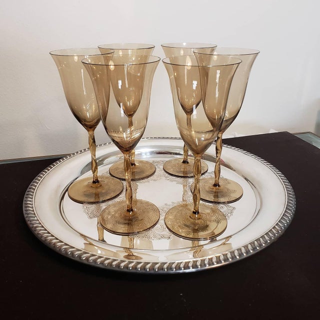 This is a stunning, collector-grade set of six (6) vintage water goblets in the iconic "Astrid" pattern, designed by...