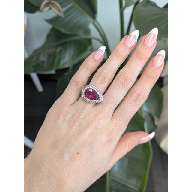 5.2ct vivid rubellite tourmaline set in solid 14k gold, radiating bold, raspberry-red brilliance. Enhanced with natural...